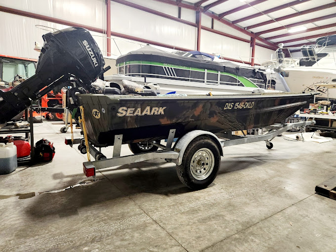Wide interior warehouse with multiple boats in storage